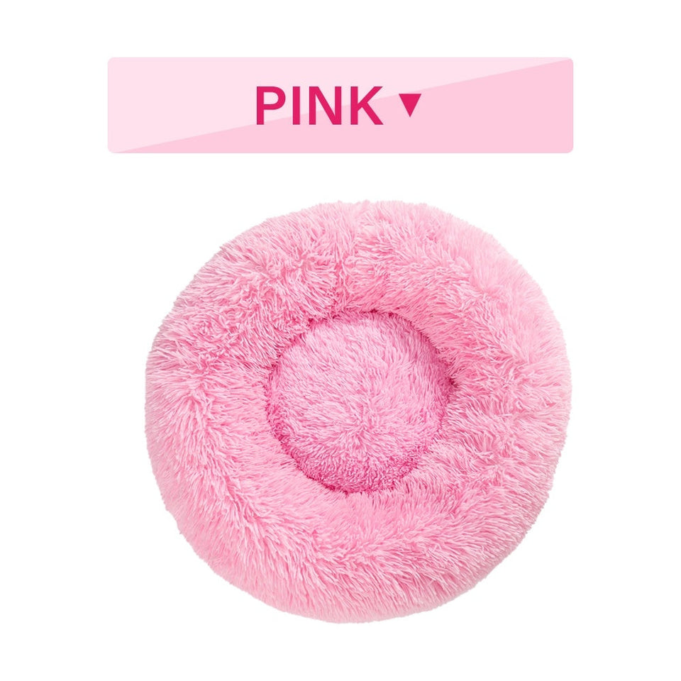 Pink fluffy donut dog bed with ultra-plush calming design for cats and dogs