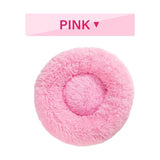 Pink fluffy donut dog bed with ultra-plush calming design for cats and dogs