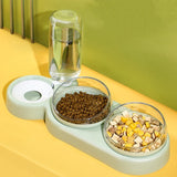 Automatic dual pet feeding bowls with water dispenser for cats and dogs in mint green