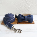 MUTTCO Cowboy Dog Collar handmade adjustable leather collar with denim bow tie and matching leash on wooden boards