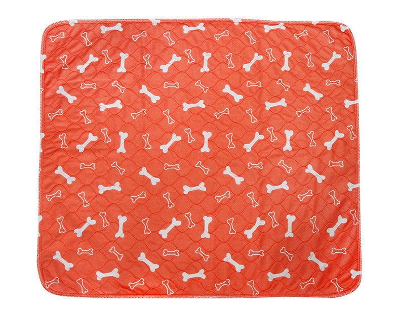 orange 3-layer waterproof pet pad with white bone pattern for dogs and cats, reusable and machine washable absorbent pee pad