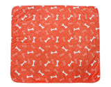 orange 3-layer waterproof pet pad with white bone pattern for dogs and cats, reusable and machine washable absorbent pee pad