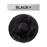 Fluffy Donut Dog Bed in black, ultra-plush round calming pet bed for cats and dogs with raised rim and soft long plush fabric.