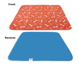 3-layer waterproof pet pad with orange bone pattern front and solid blue waterproof backing, machine washable and reusable absorbent pee pad for dogs and cats.