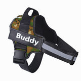 Reflective adjustable no-pull dog harness in camouflage pattern with personalized name patch and sturdy handle for control and comfort.