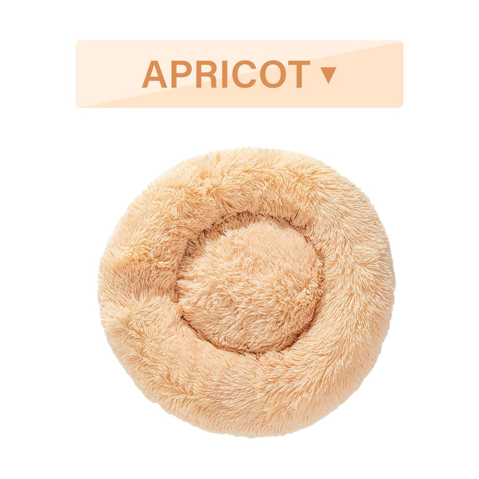 Fluffy apricot-colored donut dog bed with ultra-plush calming design for cats and dogs