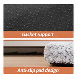 Close-up of non-slip gasket support and anti-slip pad design on luxury rose velvet dog bed's bottom for stability and safety.