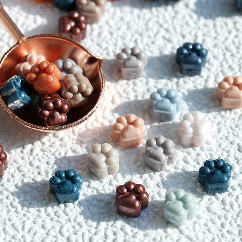 Mini cat paw wax blocks.